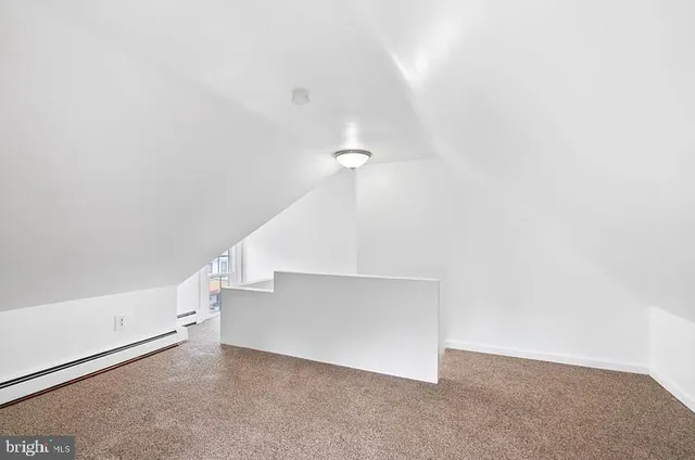 a view of an empty room with stairs