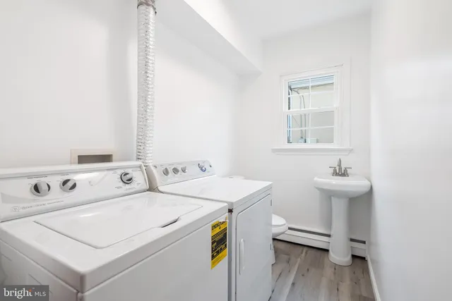 a utility room with dryer and washer
