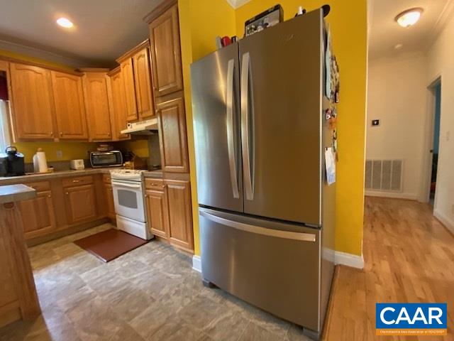 404 Rocky Road Stanardsville, VA 22973 - Photo 13 of 33 a kitchen with stainless steel appliances granite countertop a refrigerator a sink and a stove