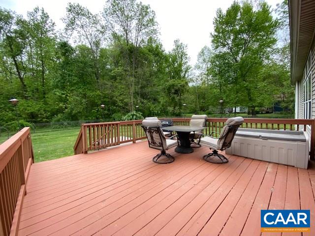 404 Rocky Road Stanardsville, VA 22973 - Photo 16 of 33 a view of deck with seating space and trees