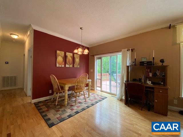 404 Rocky Road Stanardsville, VA 22973 - Photo 17 of 33 a view of a dining room with furniture window and wooden floor
