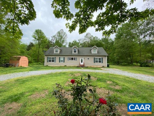 404 Rocky Road Stanardsville, VA 22973 - Photo 2 of 33 a view of a house with a big yard and large trees
