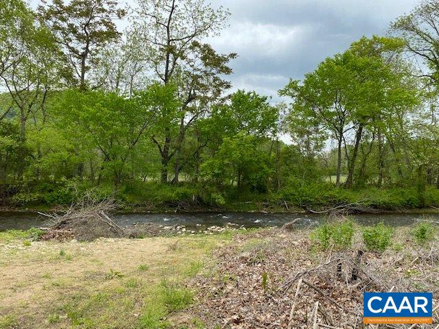 404 Rocky Road Stanardsville, VA 22973 - Photo 6 of 33 a backyard of a house with lots of green space
