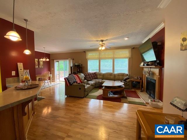 404 Rocky Road Stanardsville, VA 22973 - Photo 8 of 33 a living room with furniture a flat screen tv and a fireplace