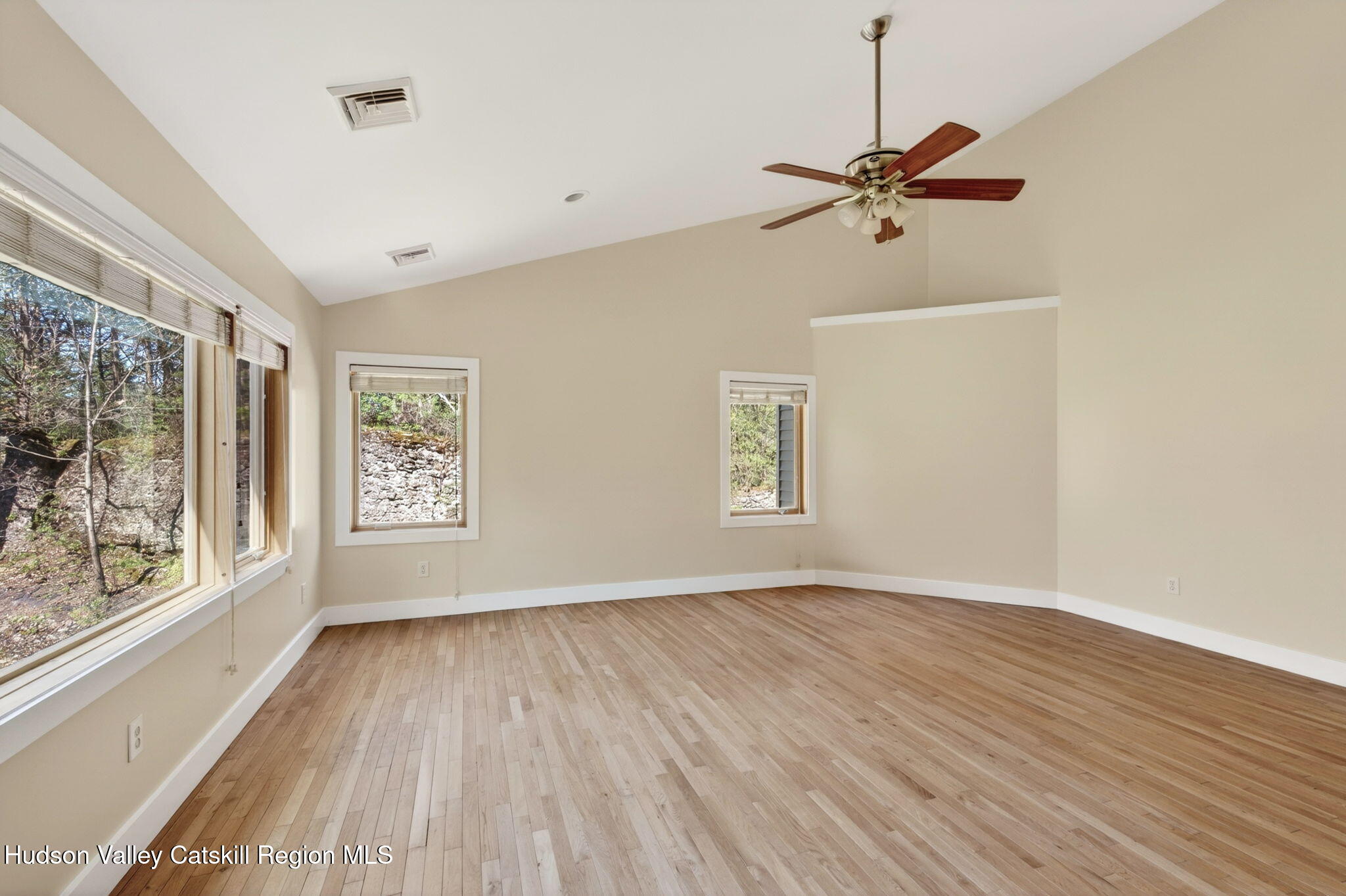 86 Paul Horn Road Catskill, NY 12414 - Photo 15 of 56 a view of empty room with wooden floor and fan