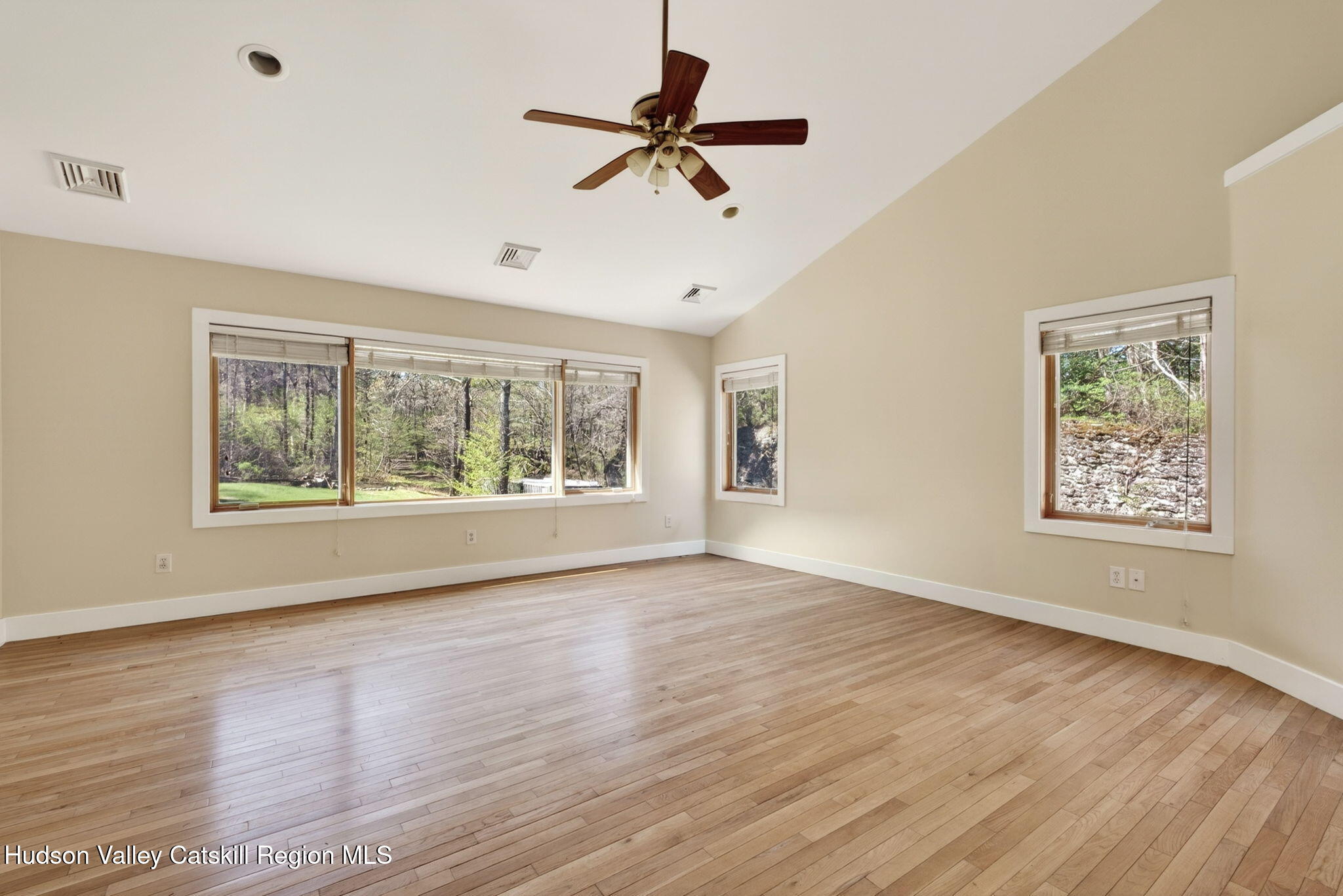 86 Paul Horn Road Catskill, NY 12414 - Photo 16 of 56 a view of an empty room with a window and wooden floor