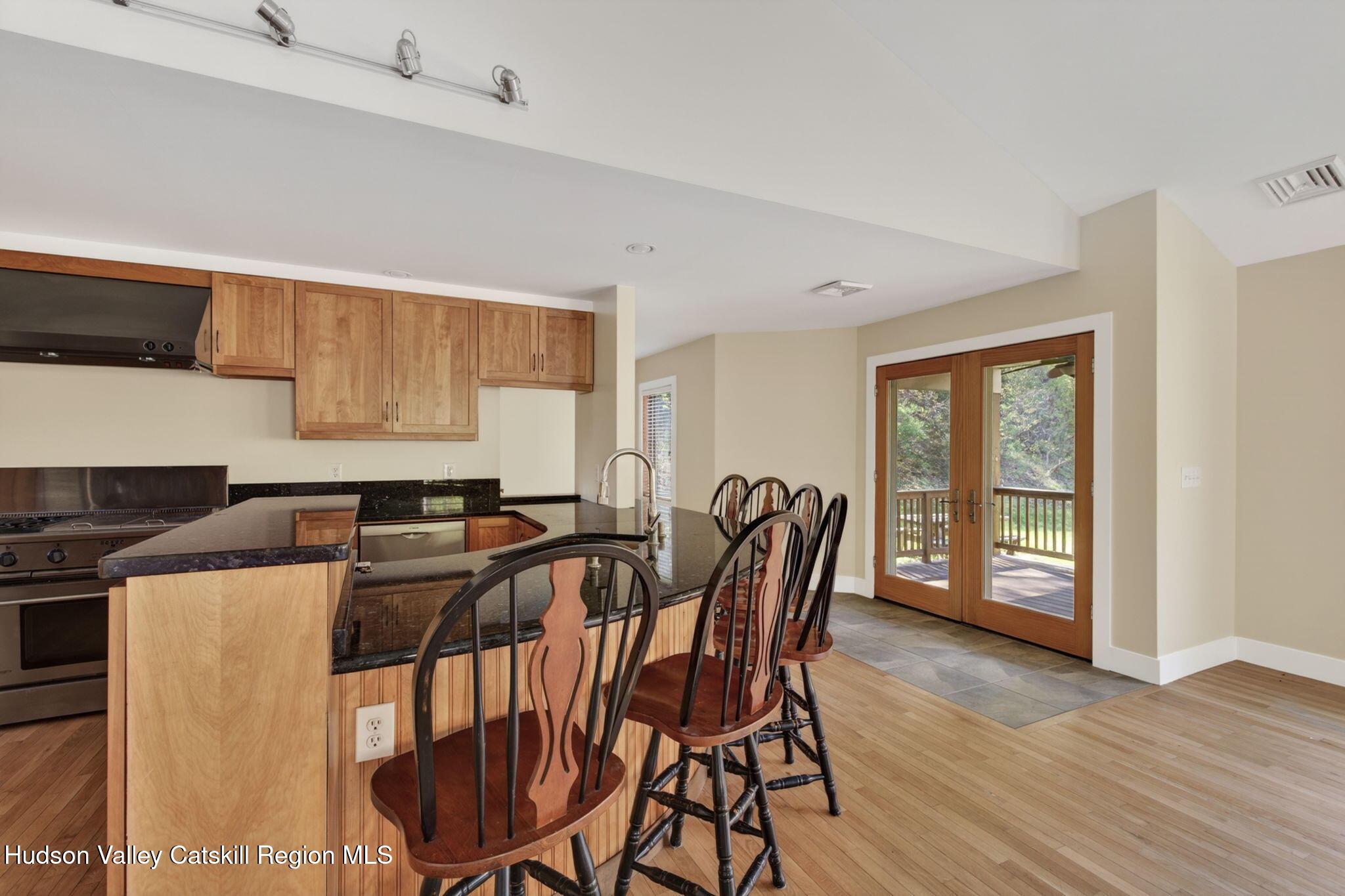 86 Paul Horn Road Catskill, NY 12414 - Photo 24 of 56 a view of a dining room with furniture and wooden floor