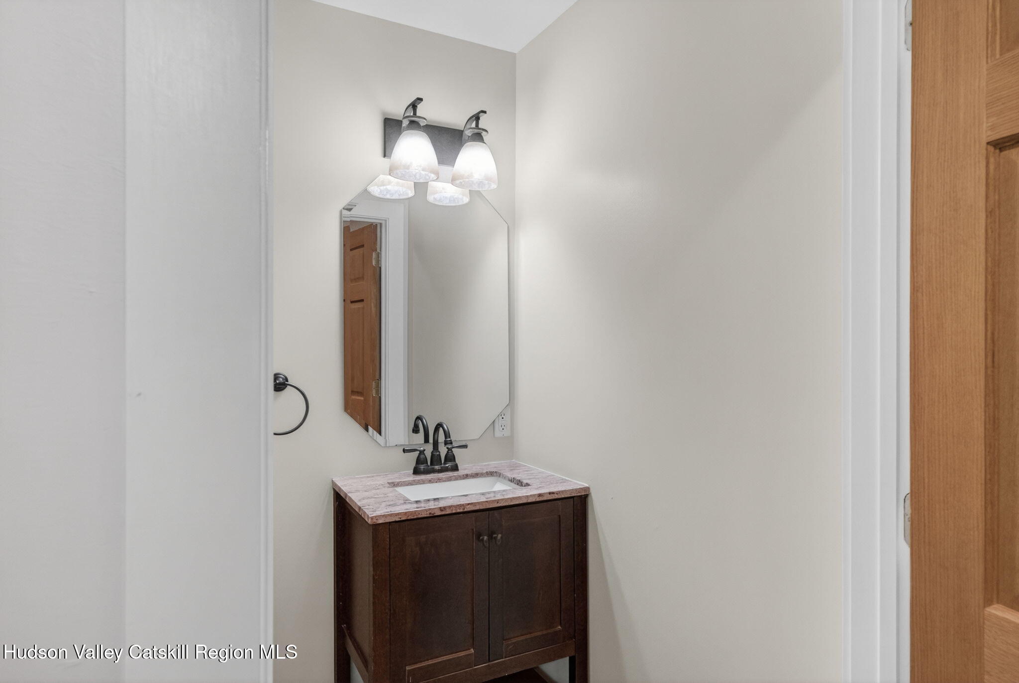 86 Paul Horn Road Catskill, NY 12414 - Photo 26 of 56 a bathroom with a sink and a mirror