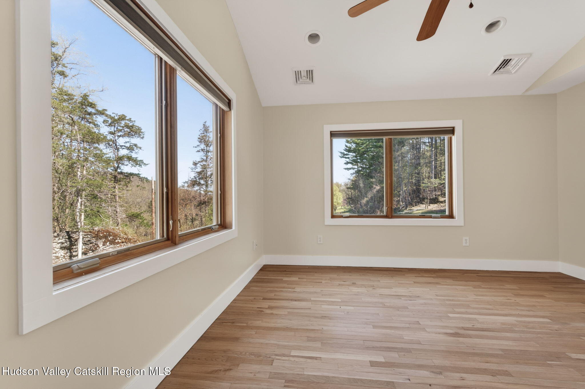 86 Paul Horn Road Catskill, NY 12414 - Photo 28 of 56 a view of an empty room with wooden floor and a window