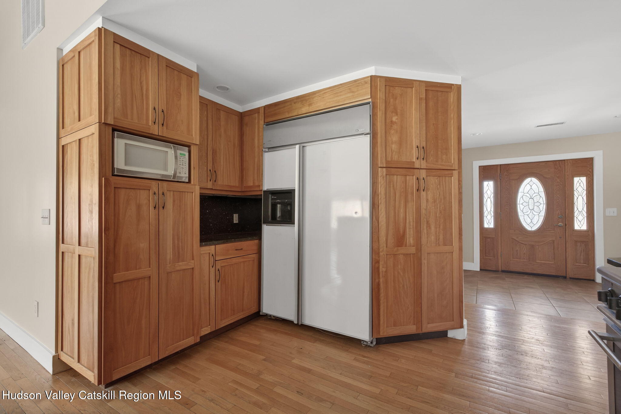 86 Paul Horn Road Catskill, NY 12414 - Photo 6 of 56 a view of a kitchen with wooden floor and electronic appliances