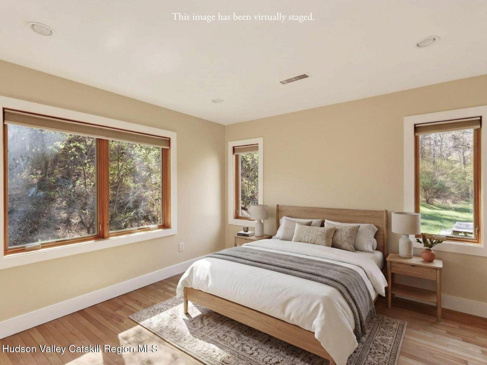 86 Paul Horn Road Catskill, NY 12414 - Photo 9 of 56 a bedroom with a bed and a large window