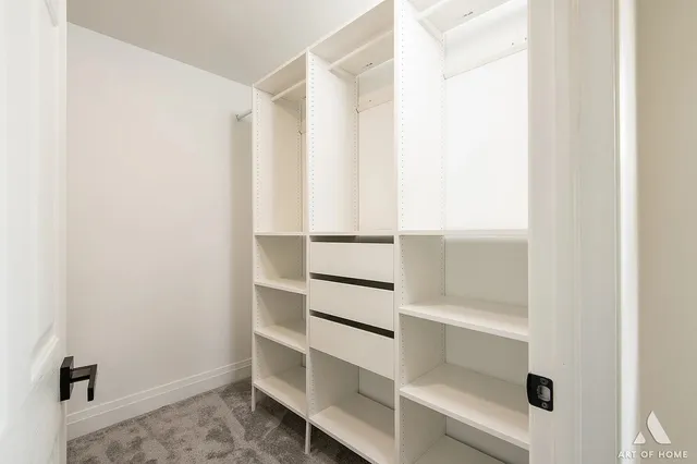 a view of an empty walk in closet