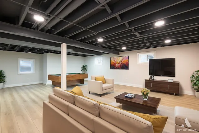 a living room with furniture and a flat screen tv