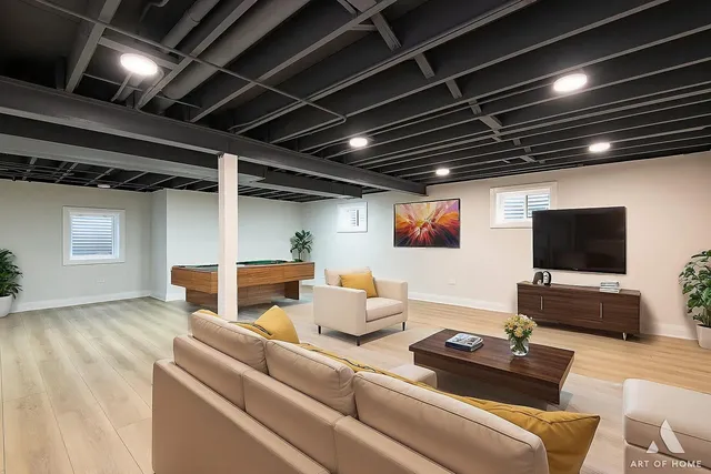 a living room with furniture and a flat screen tv