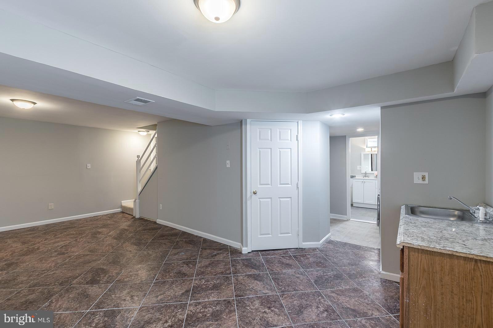 8287 Raindrop Way Springfield, VA 22153 - Photo 33 of 36 Lower level rec room with wet bar