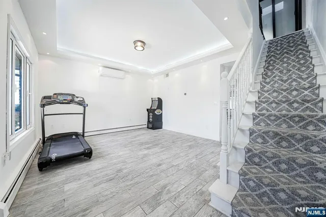 a room with a couch and a view of living room