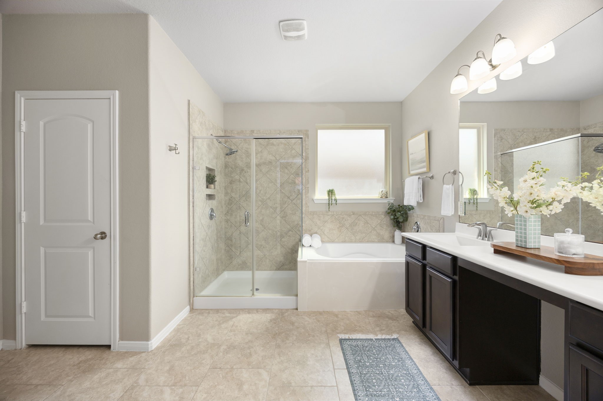 14023 Beaverhead Range Court Conroe, TX 77384 - Photo 17 of 30 This primary bathroom provides the best of both worlds, catering to both quick morning routines and relaxing evening soaks.