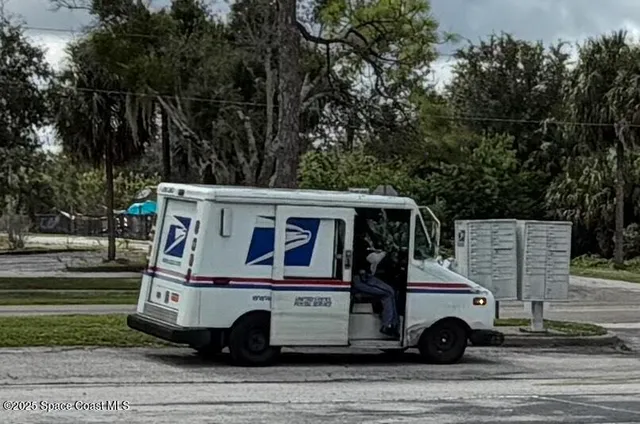 a view of a car parked on the side of the road