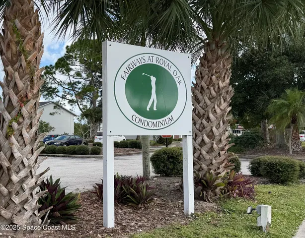 a view of a house with a swimming pool and sitting area