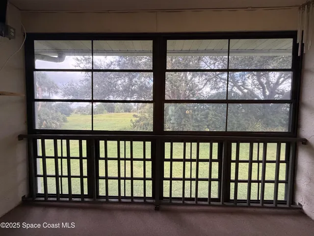 a view of staircase with a large window