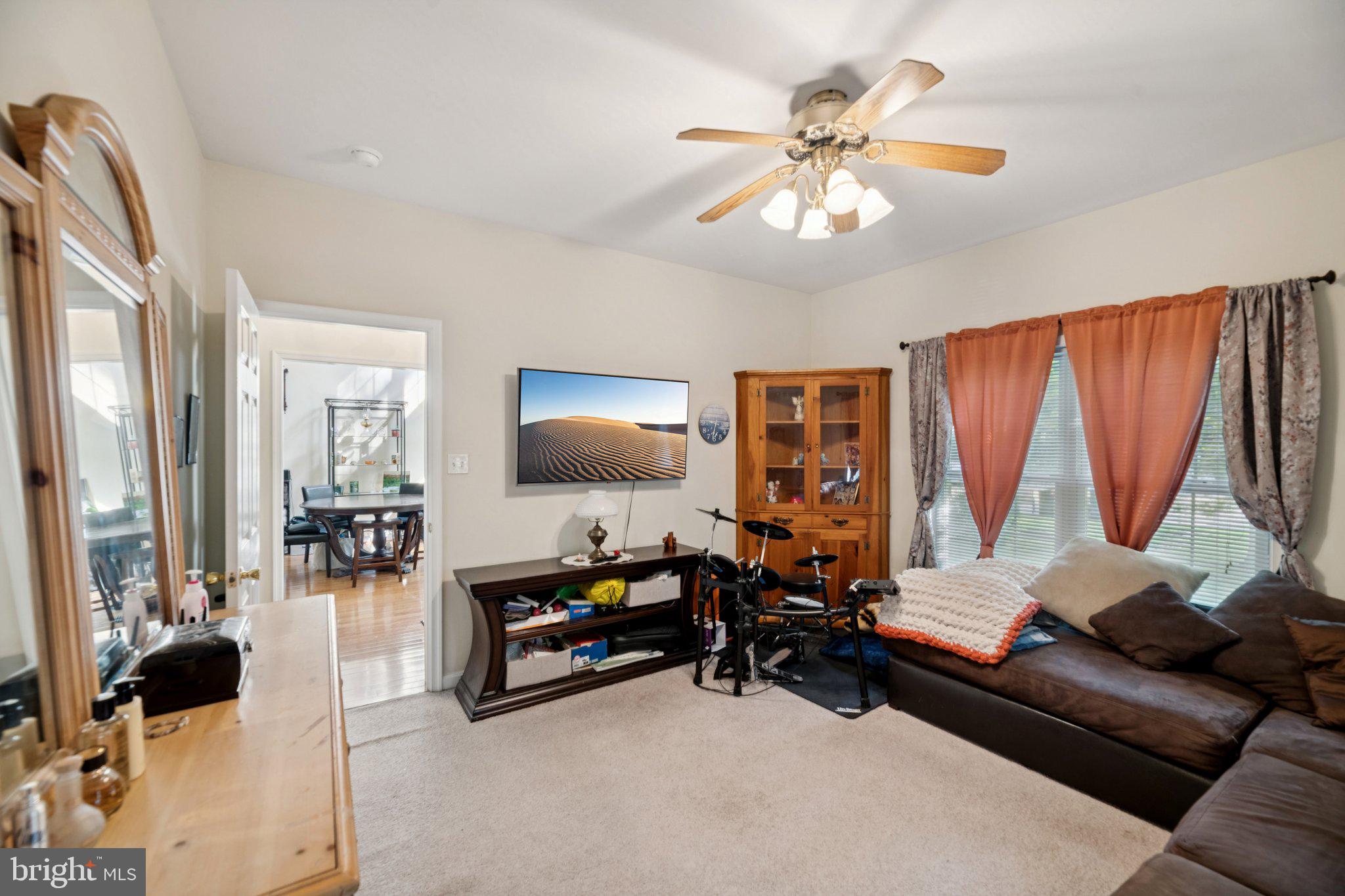 14715 Jennifer Court Issue, MD 20645 - Photo 11 of 43 a living room with furniture and a flat screen tv