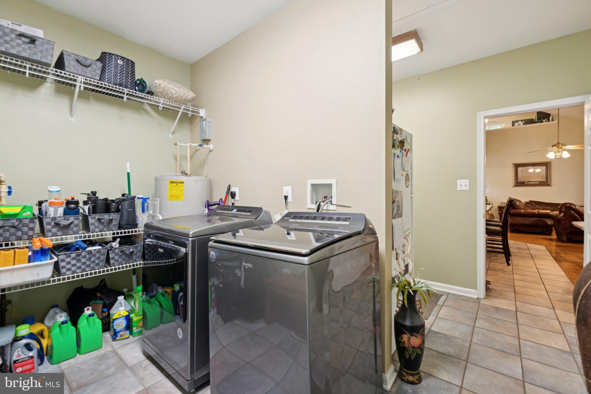 14715 Jennifer Court Issue, MD 20645 - Photo 21 of 43 a kitchen with stainless steel appliances kitchen island granite countertop lots of clutter