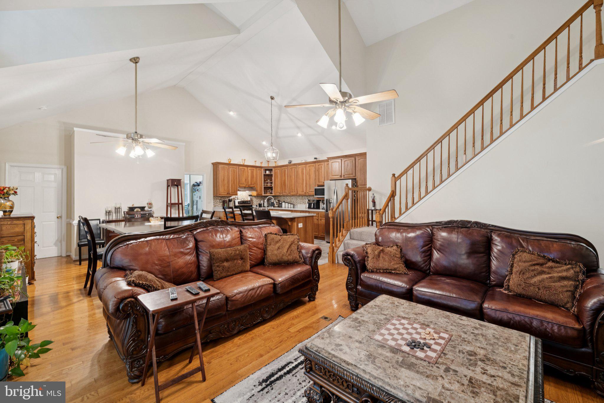 14715 Jennifer Court Issue, MD 20645 - Photo 8 of 43 a living room with furniture a ceiling fan and a rug