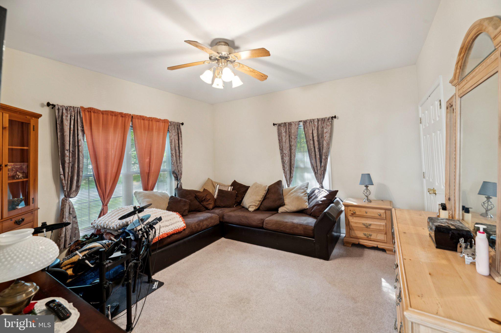 14715 Jennifer Court Issue, MD 20645 - Photo 10 of 43 a living room with furniture and a flat screen tv
