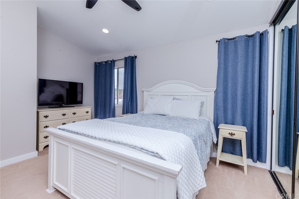 13058 Red Corral Drive Corona, CA 92883 - Photo 18 of 37 a bedroom with a bed and a flat screen tv