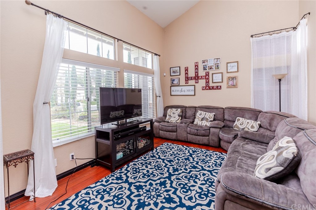 13058 Red Corral Drive Corona, CA 92883 - Photo 2 of 37 a living room with furniture and a flat screen tv
