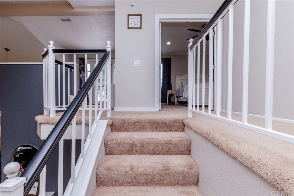 13058 Red Corral Drive Corona, CA 92883 - Photo 24 of 37 a living room with stairs