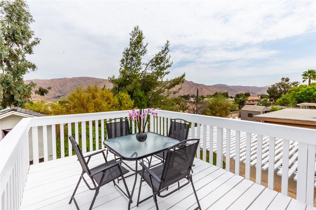 13058 Red Corral Drive Corona, CA 92883 - Photo 25 of 37 a view of balcony with furniture and trees