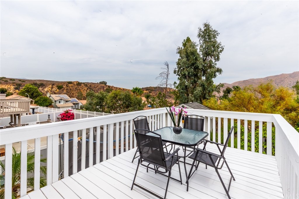 13058 Red Corral Drive Corona, CA 92883 - Photo 26 of 37 a view of a table and chairs on the roof deck