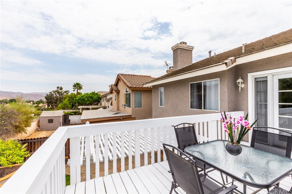 13058 Red Corral Drive Corona, CA 92883 - Photo 27 of 37 a view of a house with patio and a yard