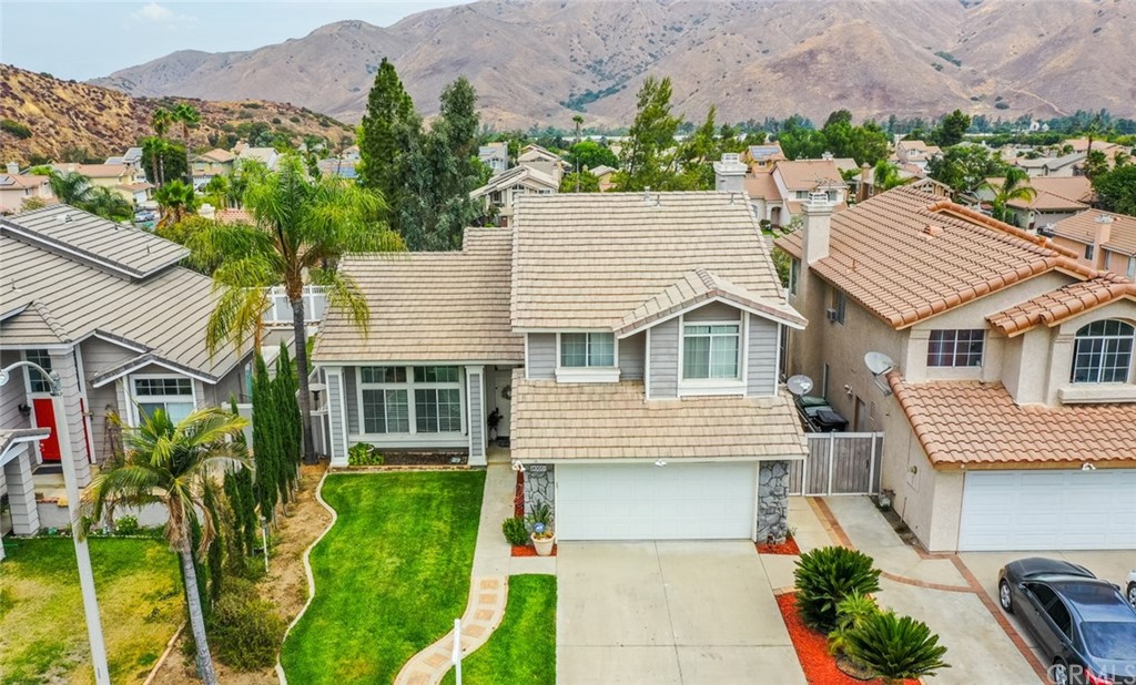 13058 Red Corral Drive Corona, CA 92883 - Photo 34 of 37 a aerial view of a house with a yard and potted plants