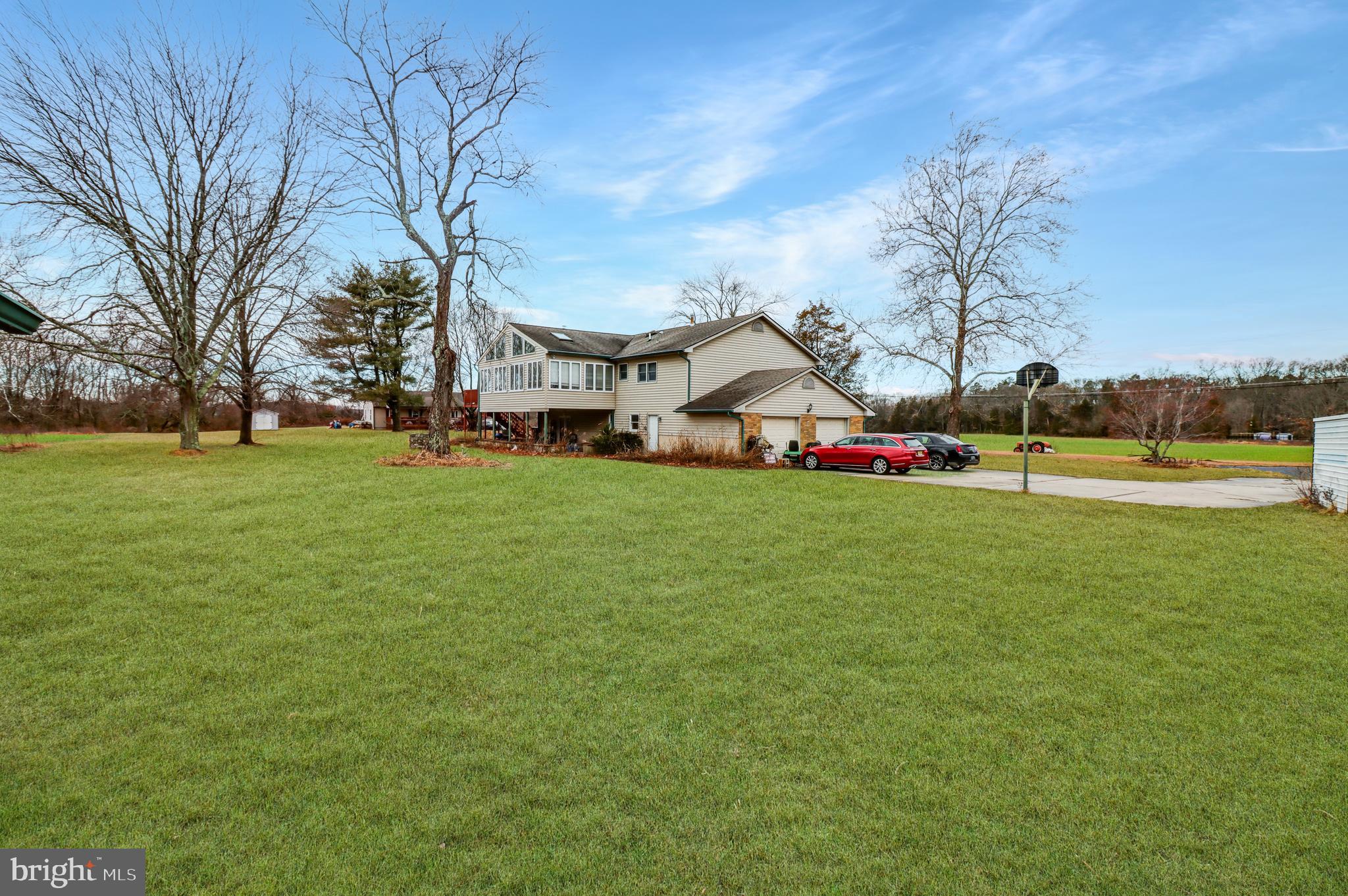 170-174 West Millstream Road Cream Ridge, NJ 08514 - Photo 17 of 109 a view of a house with a big yard and sitting area