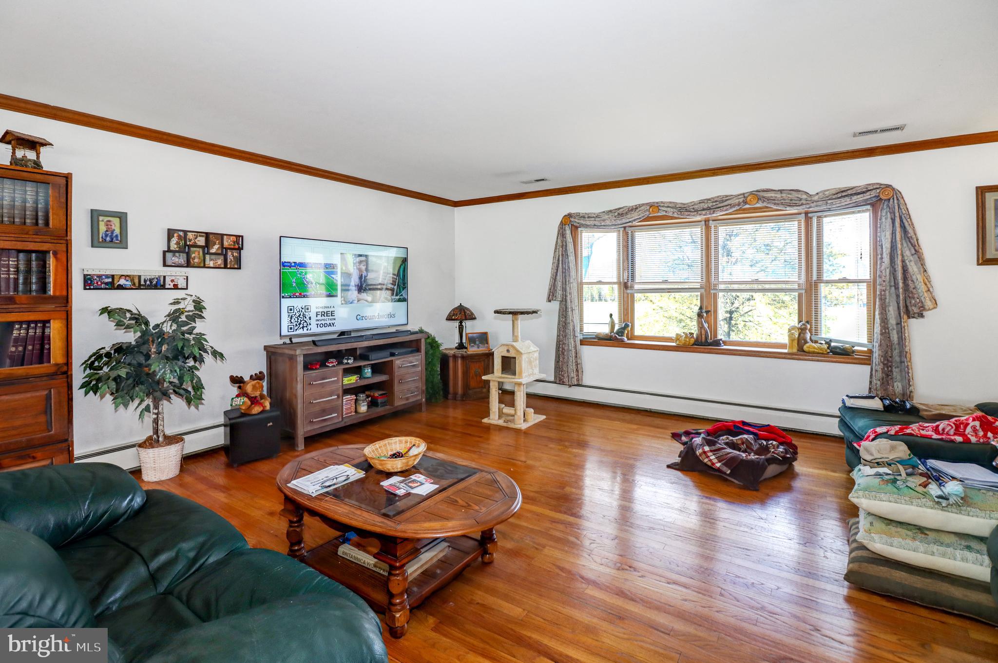 170-174 West Millstream Road Cream Ridge, NJ 08514 - Photo 20 of 109 a living room with furniture flat screen tv and a large window