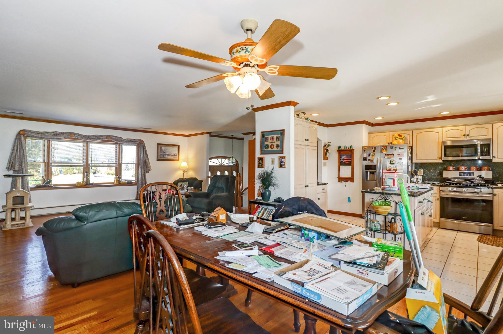 170-174 West Millstream Road Cream Ridge, NJ 08514 - Photo 25 of 109 a view of a dining room with furniture a chandelier and wooden floor