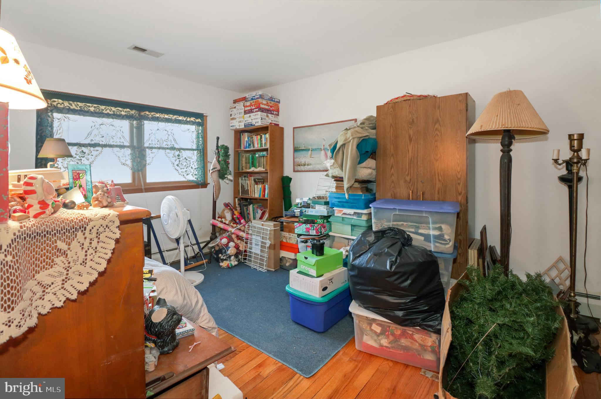 170-174 West Millstream Road Cream Ridge, NJ 08514 - Photo 41 of 109 a living room with furniture and a potted plant