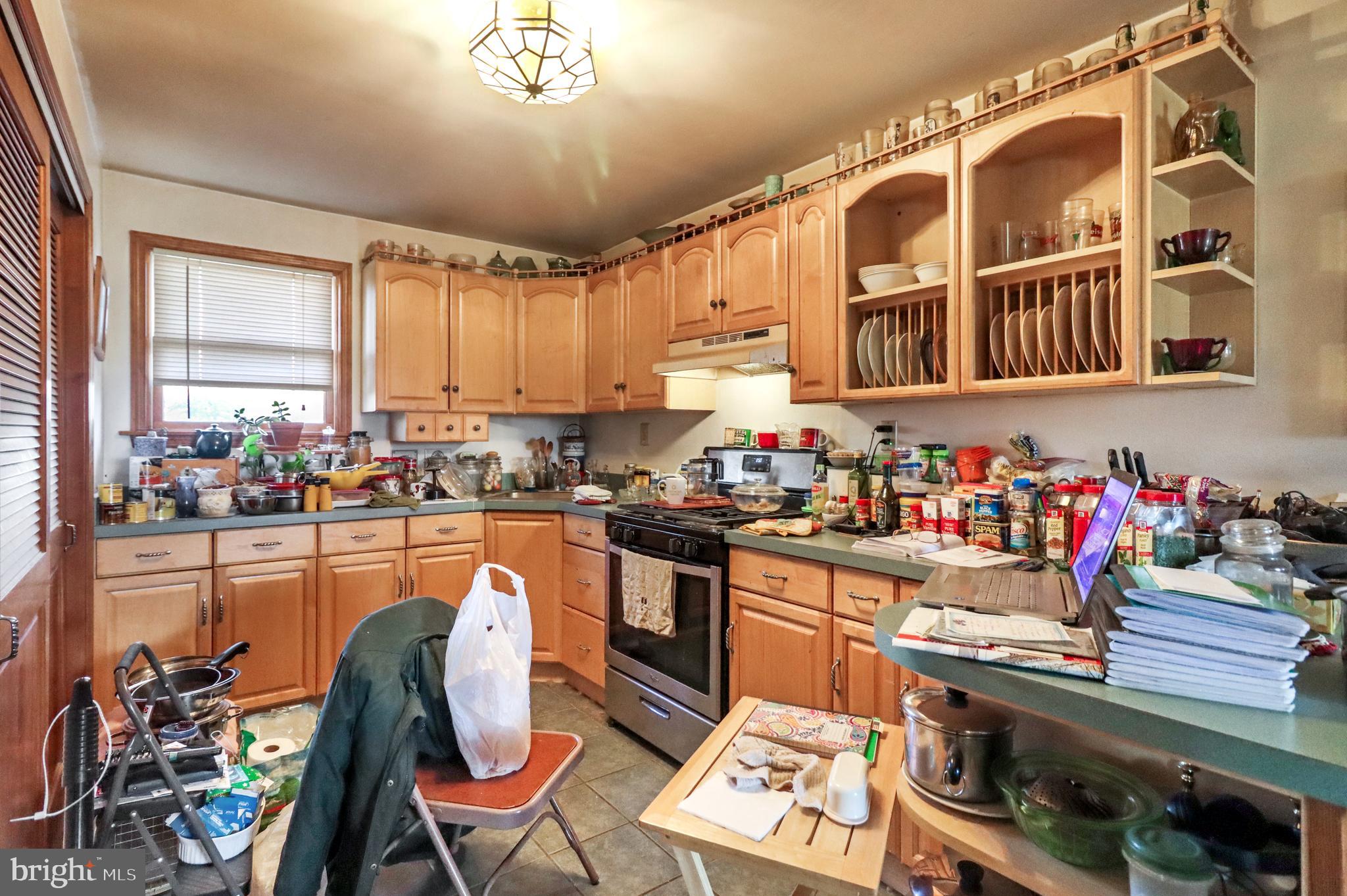 170-174 West Millstream Road Cream Ridge, NJ 08514 - Photo 52 of 109 a kitchen with stainless steel appliances granite countertop a stove and a dining table chairs