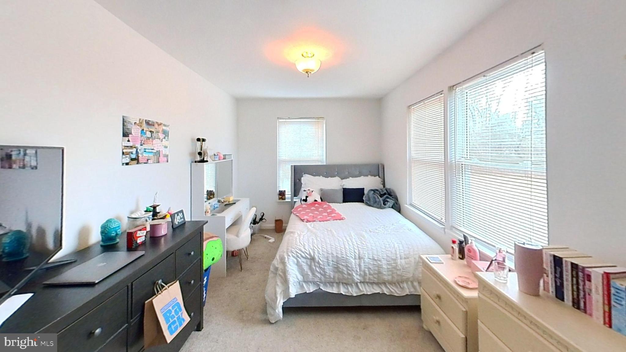 170-174 West Millstream Road Cream Ridge, NJ 08514 - Photo 85 of 109 a bedroom with a bed and a chandelier