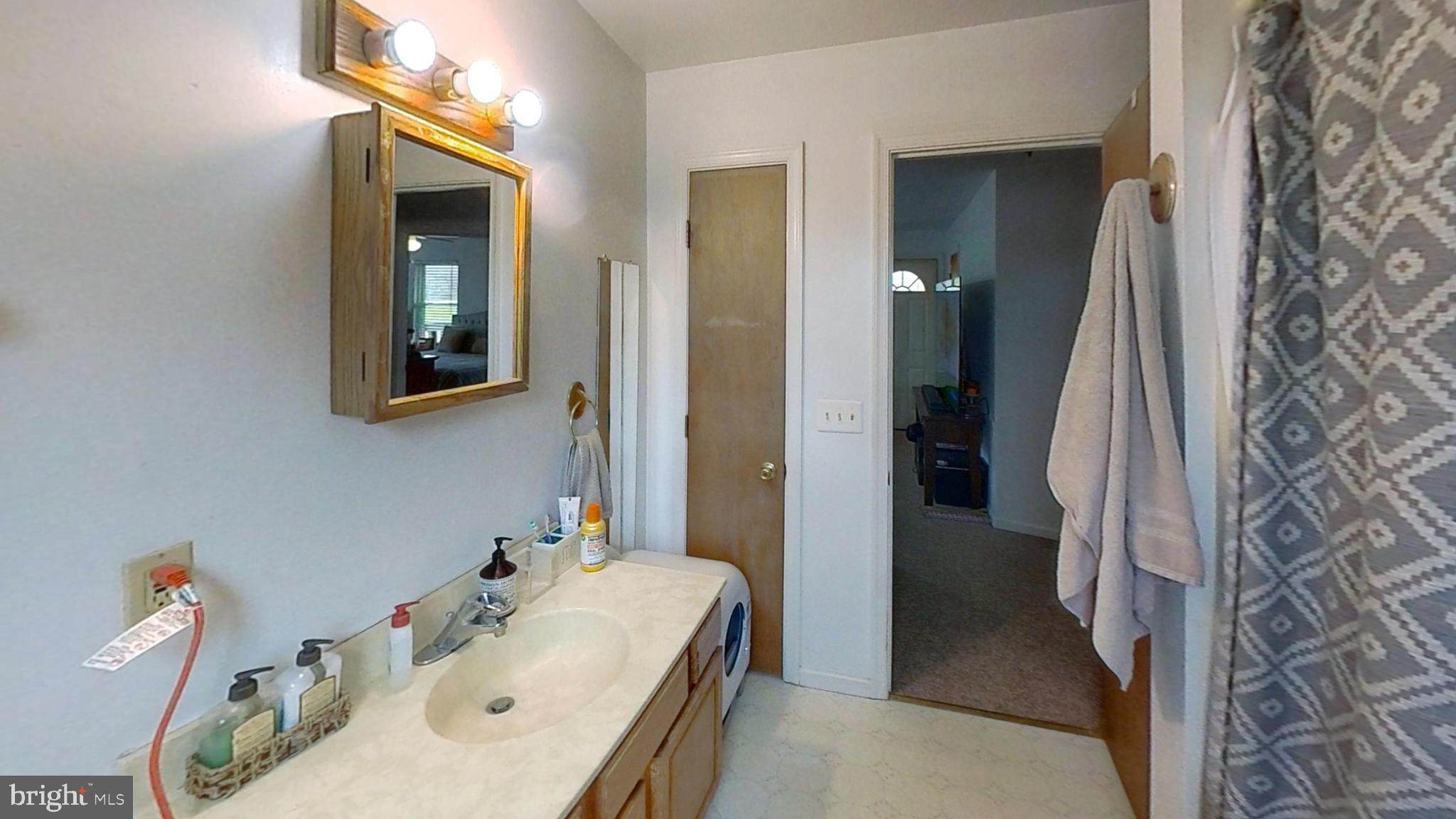 170-174 West Millstream Road Cream Ridge, NJ 08514 - Photo 87 of 109 a bathroom with a sink and a mirror