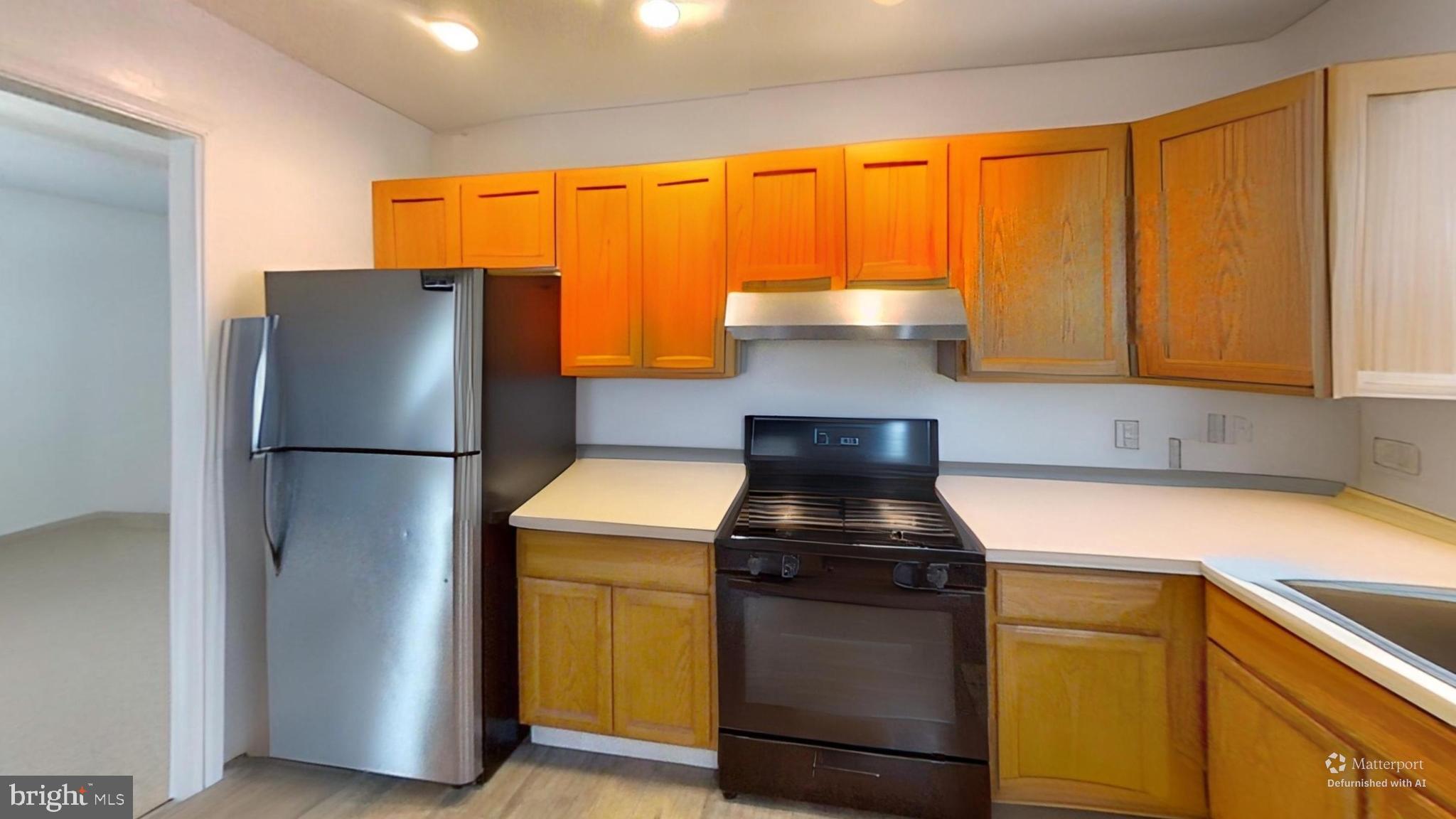 170-174 West Millstream Road Cream Ridge, NJ 08514 - Photo 90 of 109 a kitchen with a refrigerator and a stove