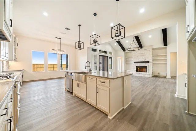 a kitchen with white cabinets and white appliances