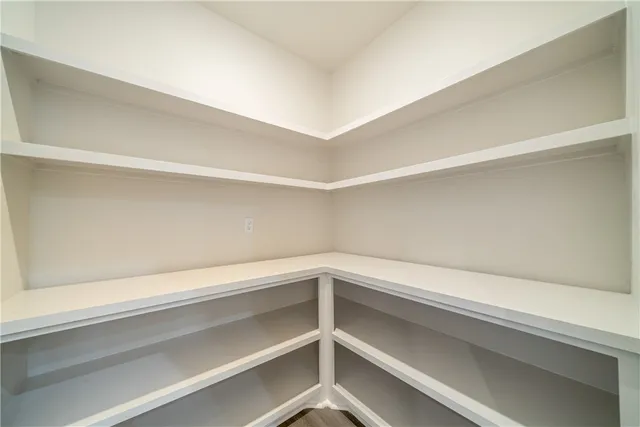a view of a livingroom with a hardwood floor and a ceiling fan
