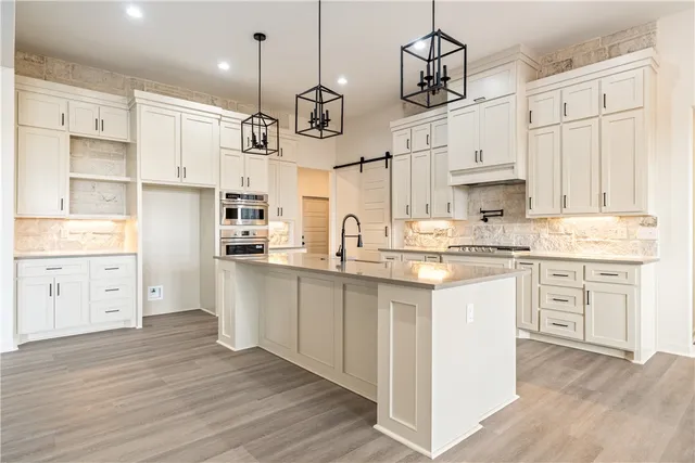 a bathroom with double vanity sinks and a mirror