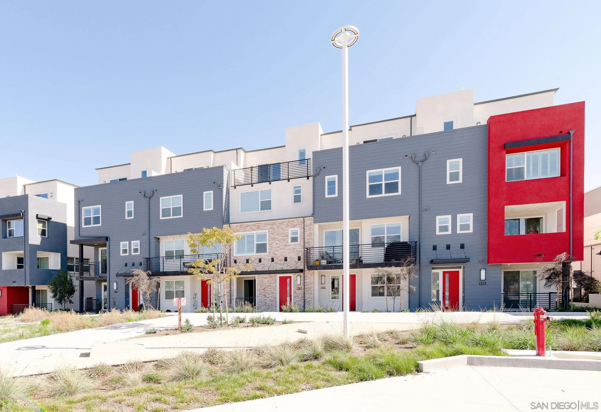 1983 Elevate Way Chula Vista, CA 91915 - Photo 1 of 39 a view of tall building with a street