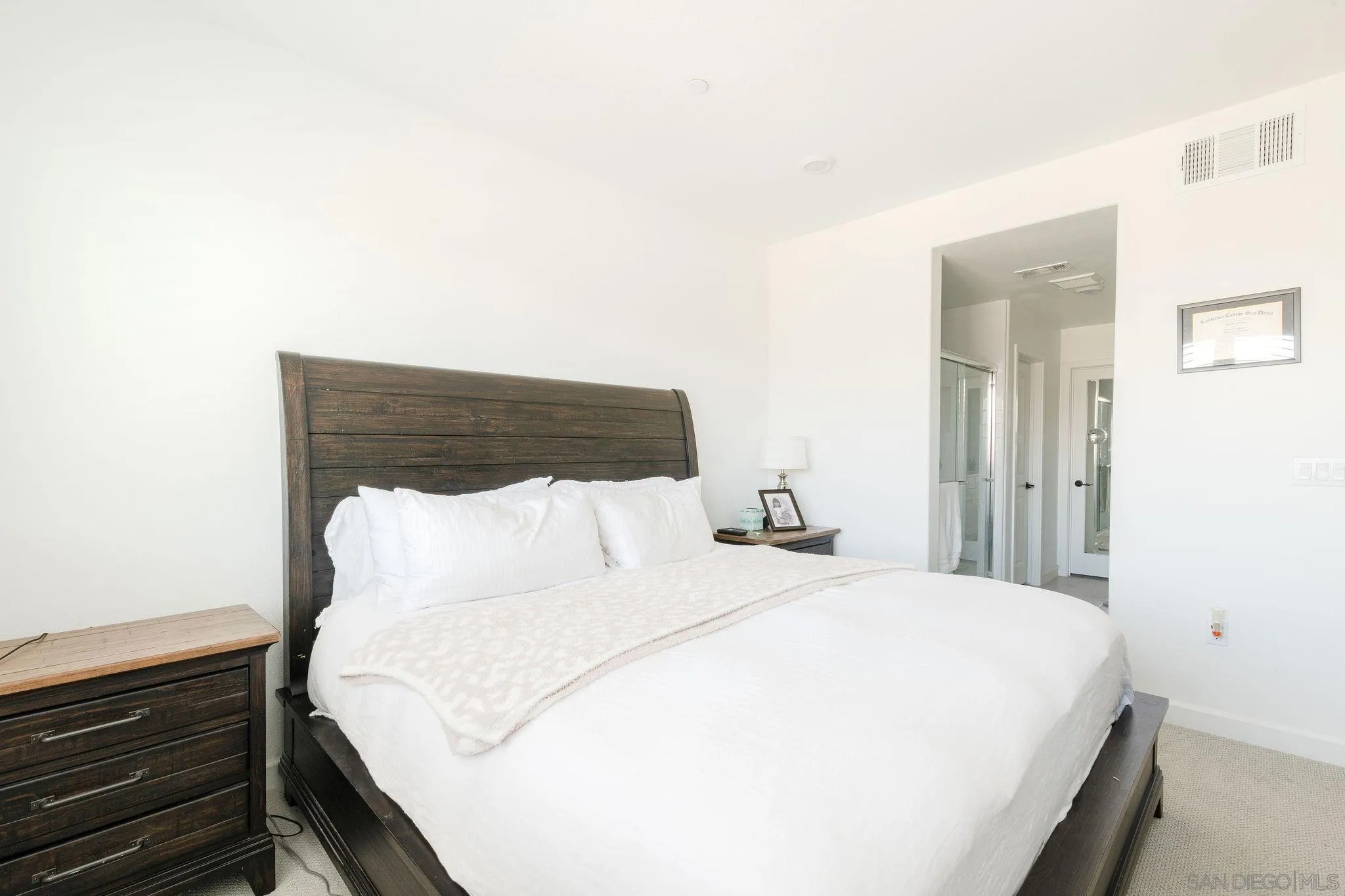 1983 Elevate Way Chula Vista, CA 91915 - Photo 12 of 39 a bedroom with a bed and a night stand