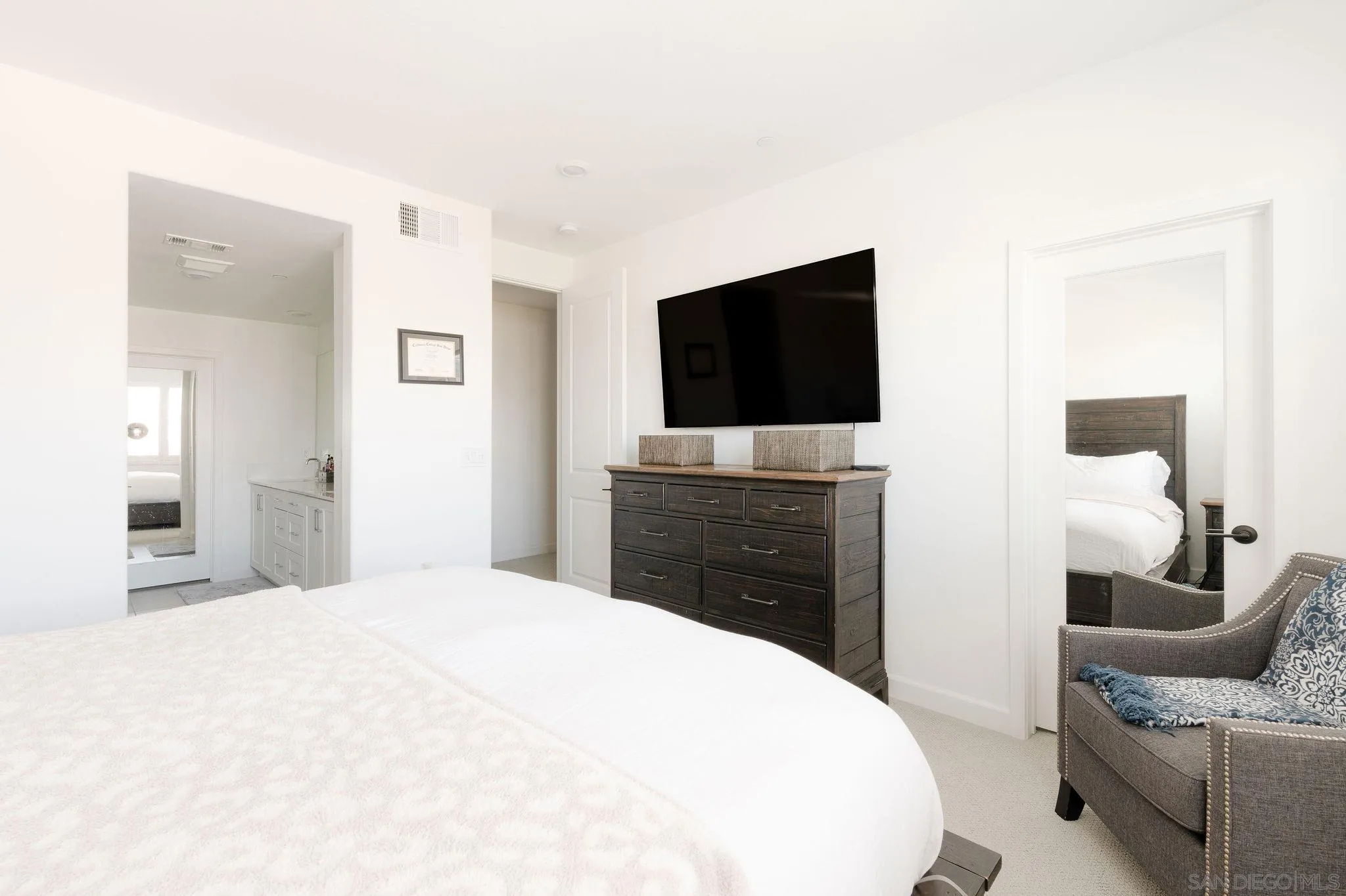 1983 Elevate Way Chula Vista, CA 91915 - Photo 13 of 39 a bedroom with a bed and a flat screen tv