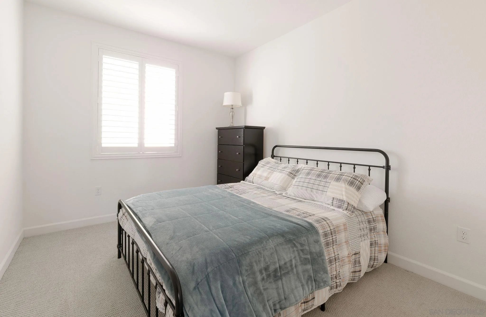 1983 Elevate Way Chula Vista, CA 91915 - Photo 24 of 39 a bedroom with a bed and window